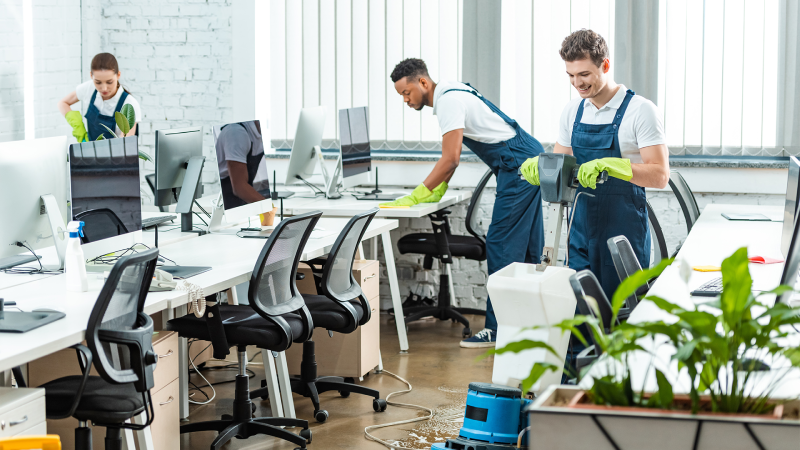 Day porter cleaning staff disinfecting office surfaces in Chicago North